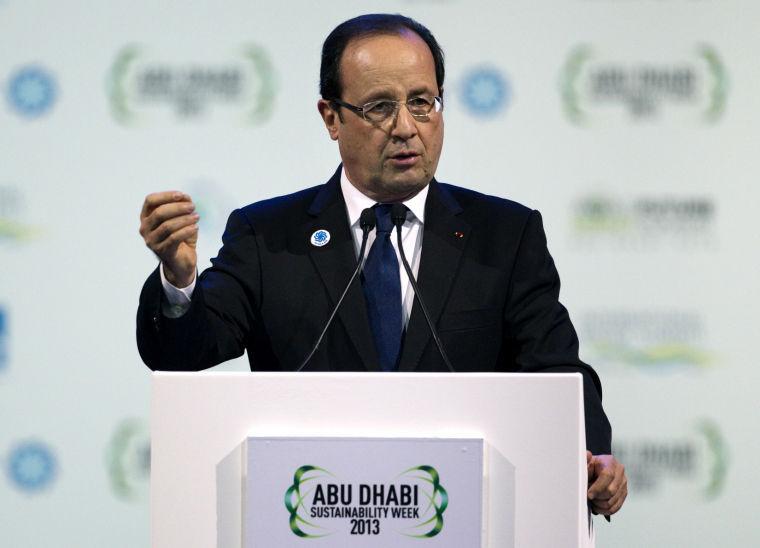 In this image made available by the Abu Dhabi Crown Prince Court, French president Francois Hollande speaks at the opening ceremony of World Future Energy Summit, part of Abu Dhabi Sustainability Week 2013, at the Abu Dhabi National Exhibition Centre in Abu Dhabi, United Arab Emirates. (AP Photo/Abu Dhabi Crown Prince Court, Sammy Dallal)
 