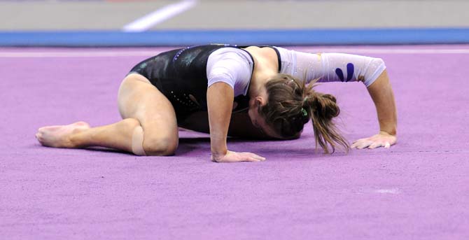 LSU junior all-around Kaleigh Dickson slams to the ground to finish her floor routine Jan. 4, 2013 during the Tiger's 196-194 win over NC State in the PMAC.
 