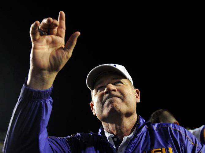 LSU head coach Les Miles celebrates the Tiger's 37-17 victory over Mississippi State University on Saturday, Nov. 10, 2012 in Tiger Stadium.