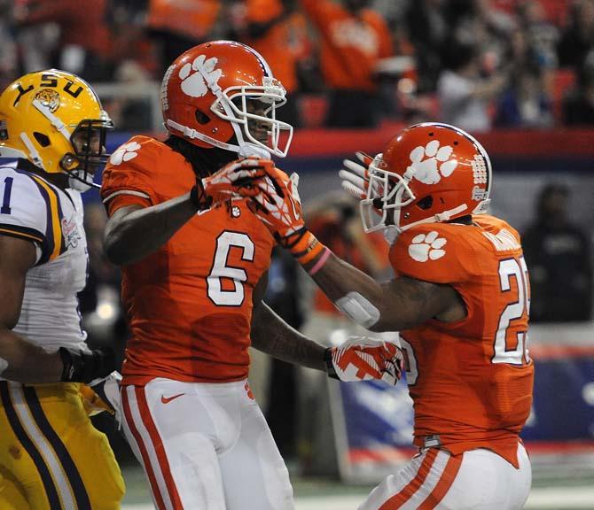 Clemson wide receiver DeAndre Hopkins celebrates with running back Roderick McDowell after scoring a touchdown Monday, Dec. 31, 2012 during the Tigers' 24-25 loss in the Chick-fil-A Bowl against Clemson in Atlanta, Ga.
 