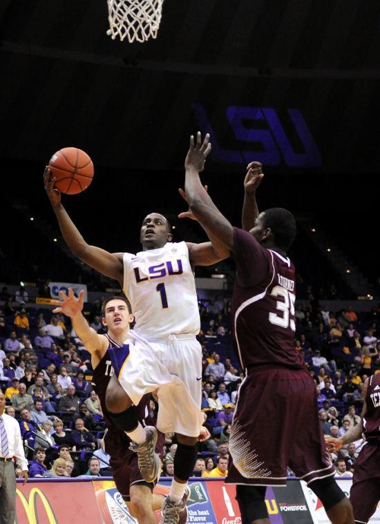 LSU sophomore Anthony Hickey (1) lays up Wednesday, Jan. 23, 2013 the basketball over Texas A&amp;M senior foward Ray Turner (35) in the 58-54 victory over Texas A&amp;M in the PMAC.
 