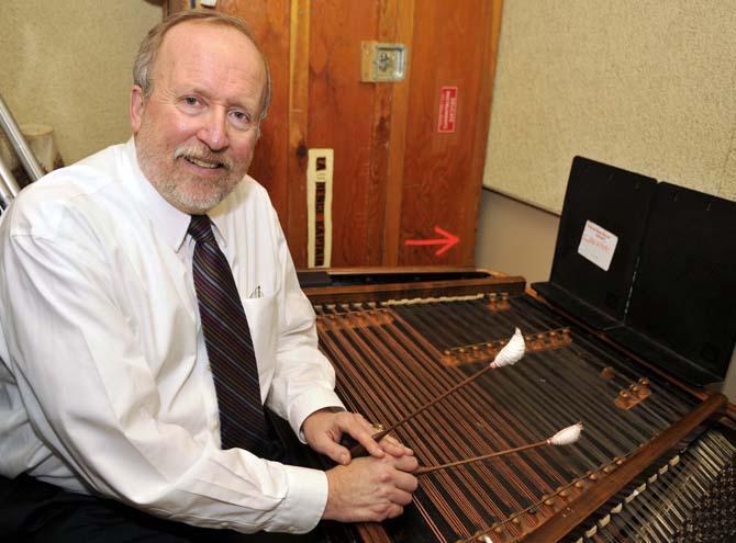 College of Music &amp; Dramatic Arts Dean Laurence Kaptain poses with his cimbalom Tuesday Jan. 29, 2013 in his practice space in the Music and Dramatic Arts building.