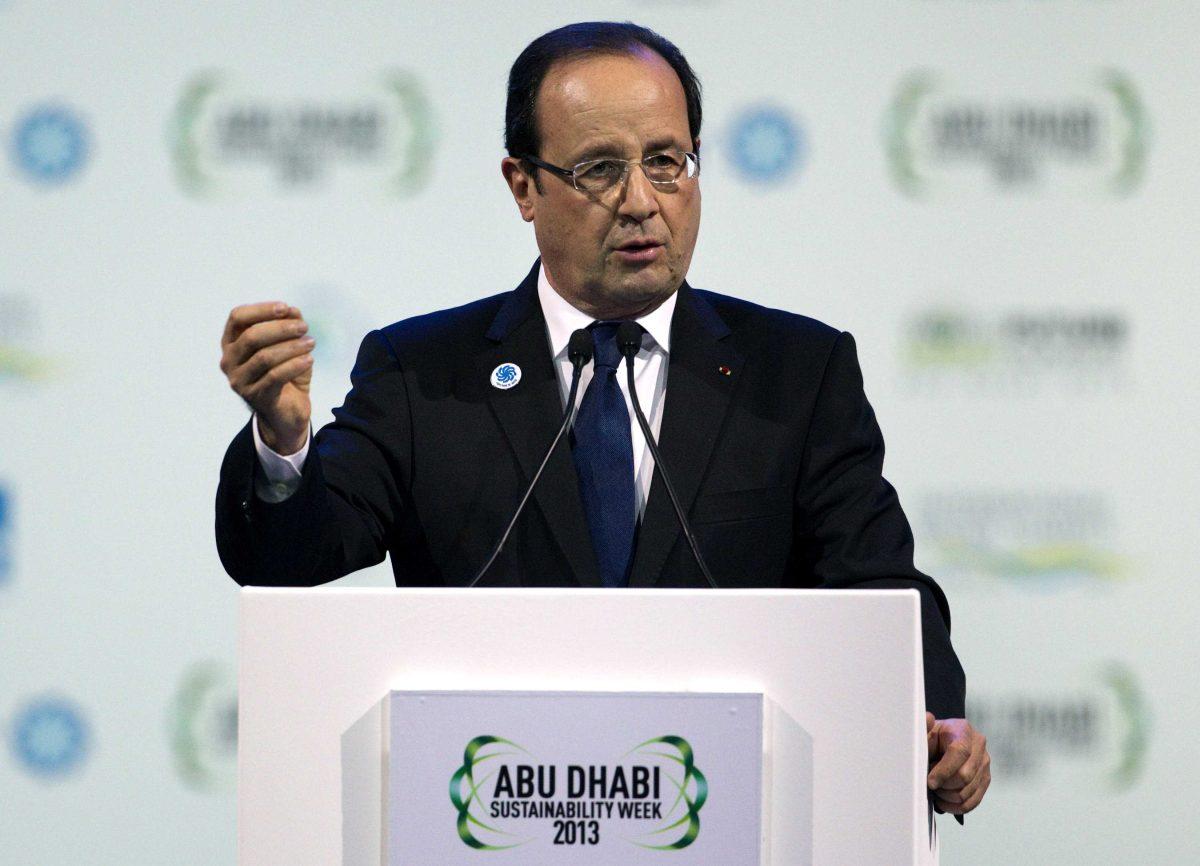 In this image made available by the Abu Dhabi Crown Prince Court, French president Francois Hollande speaks at the opening ceremony of World Future Energy Summit, part of Abu Dhabi Sustainability Week 2013, at the Abu Dhabi National Exhibition Centre in Abu Dhabi, United Arab Emirates. (AP Photo/Abu Dhabi Crown Prince Court, Sammy Dallal)