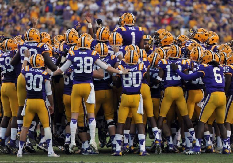 LSU junior safety Eric Reid (1) jumps during a pregame huddle before the Tigers' win against Idaho Saturday, Sept. 15, 2012.