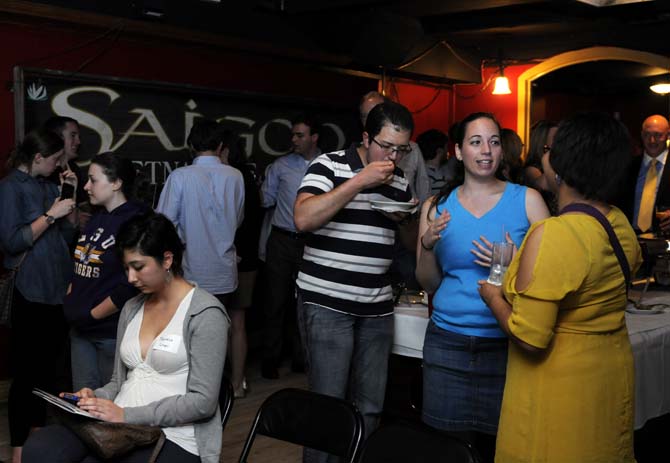 Attendees of Chelsea's Cafe's Science Cafe event eat, drink and socialize on Tuesday, Jan. 29, 2013 at Chelsea's Cafe.
 