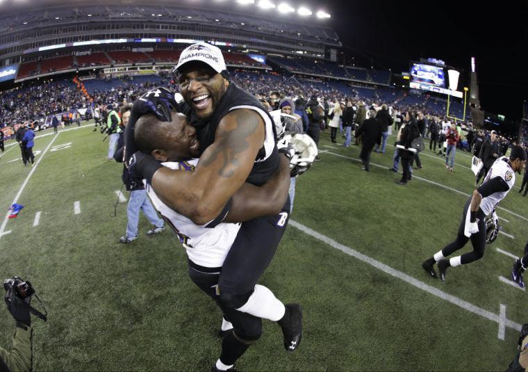 Baltimore Ravens inside linebacker Ray Lewis, right, celebrates with Vonta Leach after the NFL football AFC Championship football game against the New England Patriots in Foxborough, Mass., Sunday, Jan. 20, 2013. The Ravens defeated the Patriots 28-13 to advance to Super Bowl XLVII. (AP Photo/Matt Slocum)
 