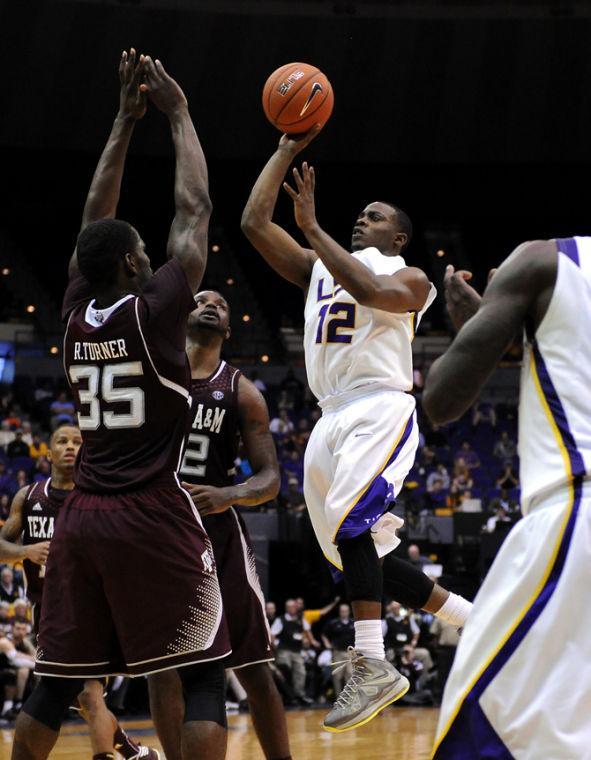 LSU sophomore Anthony Hickey (12) shoots Wednesday, Jan. 23, 2013 over Texas A&amp;M senior forward Ray Turner (35) in the Tigers' 58-54 victory over the Aggies in the PMAC.
 