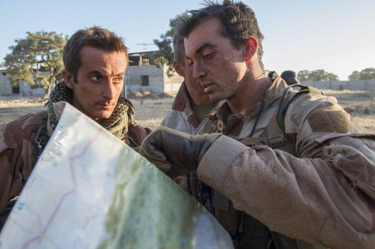 In this picture released by the French Army Communication Audiovisual office (ECPAD) French soldiers check a map at an undisclosed location, north of the Malian capital, Bamako, Wednesday, Jan. 16, 2013. French troops pressed northward in Mali toward territory occupied by radical Islamists on Wednesday, military officials said, announcing the start of a land assault that will put soldiers in direct combat "within hours." (AP Photo/Arnaud Roine, ECPAD)
 