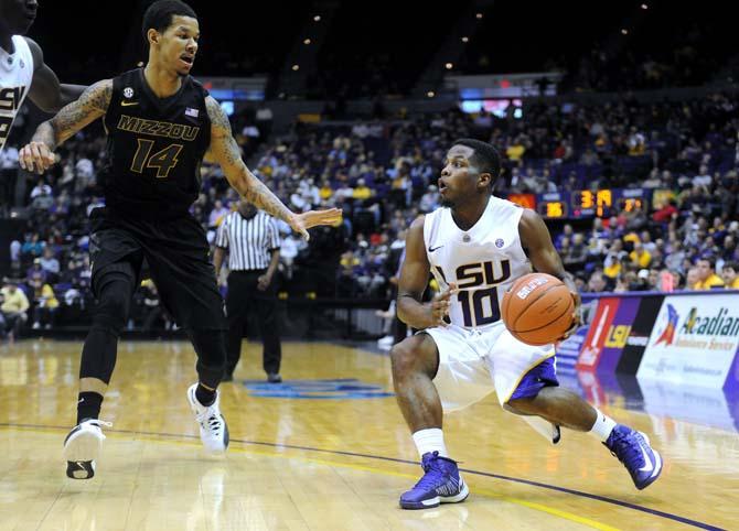 LSU junior guard Andre Stringer (10) prepares to move around Missouri freshman guard Negus Webster-Chan (14) during the Tigers' 73-70 victory against Mizzou Wednesday Jan. 30, 2013 in the PMAC.
 