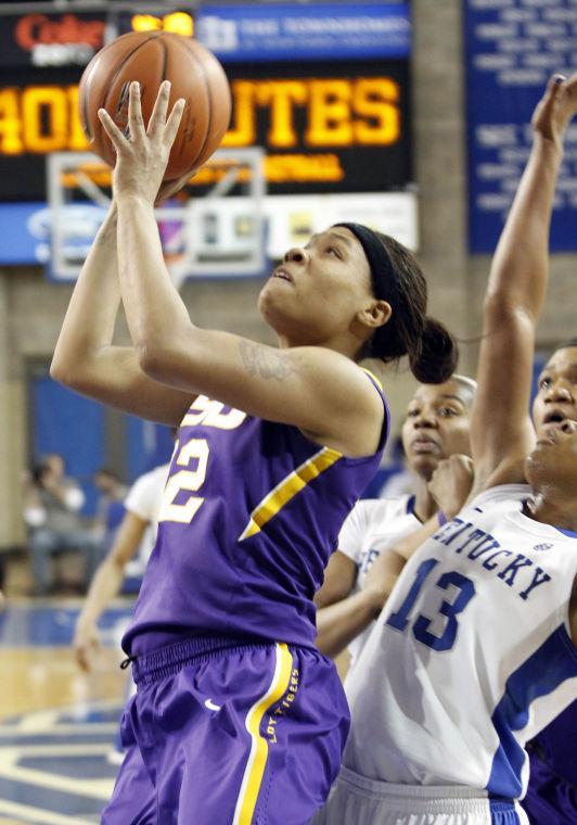 LSU's Danielle Ballard, left, shoots next to Kentucky's Bria Goss during the first half of an NCAA college basketball game at Memorial Coliseum in Lexington, Ky., Sunday, Jan. 27, 2013. (AP Photo/James Crisp)
 