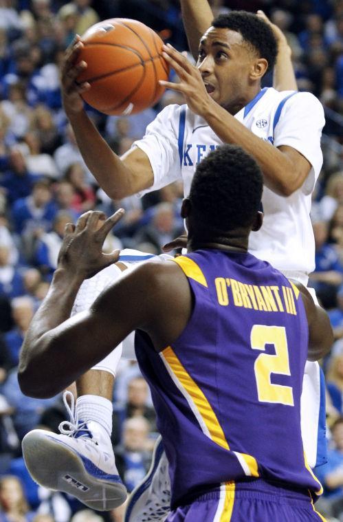 Kentucky's Ryan Harrow, top, looks for a shot over LSU's Johnny O'Bryant III (2) during the first half of an NCAA college basketball game at Rupp Arena in Lexington, Ky., Saturday, Jan. 26, 2013. (AP Photo/James Crisp)
 