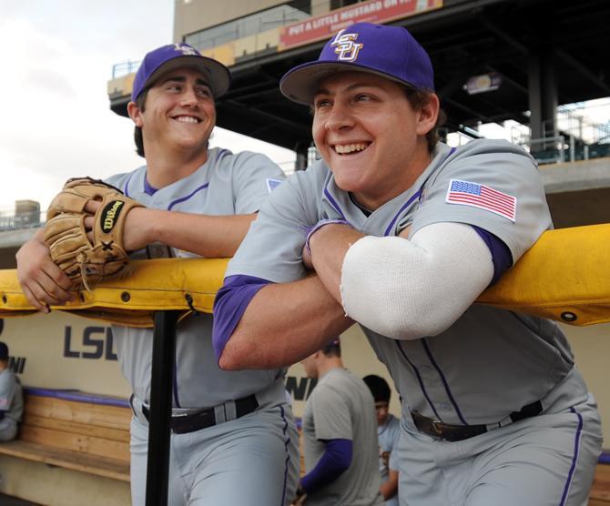 LSU junior pitcher Nate Fury (left) and senior out elder Mason Katz (right) lean on the railing Tuesday at Alex Box Stadium. The two players grew up together in Jefferson Parish.
 