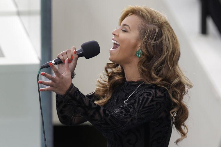 Beyonce sings the National Anthem at the ceremonial swearing-in for President Barack Obama at the U.S. Capitol during the 57th Presidential Inauguration in Washington, Monday, Jan. 21, 2013. (AP Photo/Evan Vucci)
 