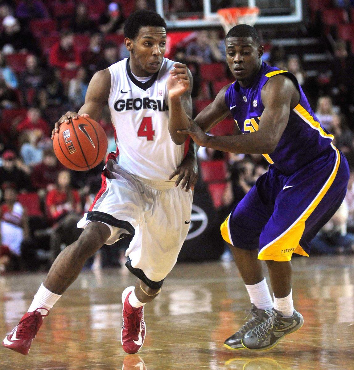 LSU guard Anthony Hickey (1) pressures Georgia guard Charles Mann (4) during the first half of an NCAA college basketball game Saturday, Jan. 19, 2013, in Athens, Ga. (AP Photo/Athens Banner-Herald, Richard Hamm) MANDATORY CREDIT MAGS OUT