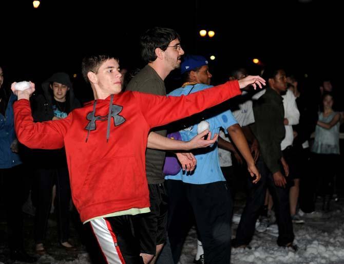 Students throw snowballs at each other on the parade grounds Monday, Jan. 28, 2013.
 