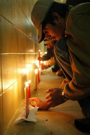 In this 2008 file photo, Students, friends, teachers and collegues of Ph.D. students Chandrasekhar Reddy Komma and Kiran Kumar Allam participate in a candlelight vigil.
 