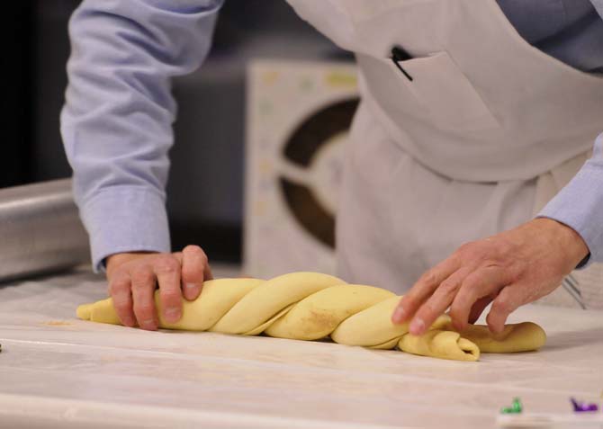 Felix Sherman Jr., the owner of Ambrosia Bakery, does a demonstration on how to make their delicious king cakes at the LSU Museum of Art on January 17, 2012.