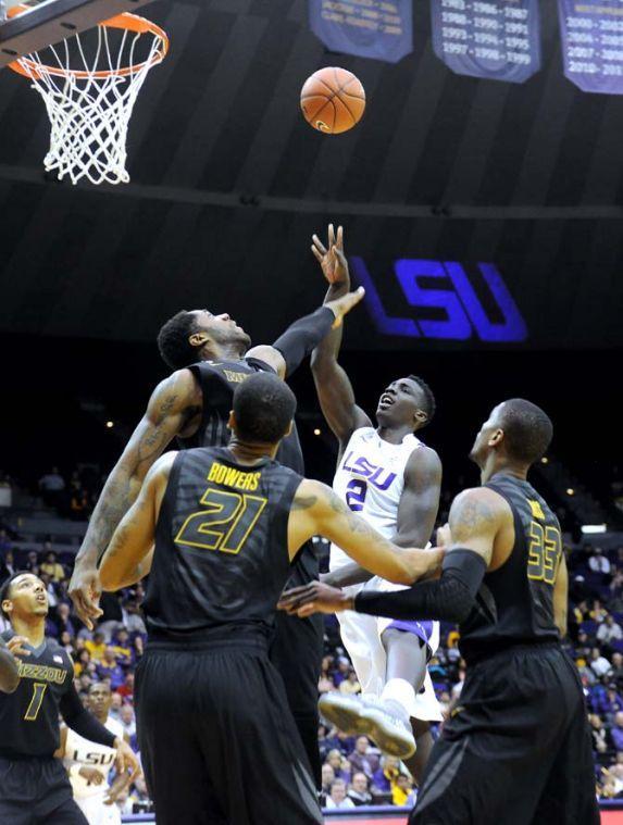 LSU sophomore forward Johnny O'Bryant III (2) puts up a shot over Missouri senior forward Alex Oriakhi (42) during the Tigers' 73-70 victory against Mizzou Wednesday Jan. 30, 2013 in the PMAC.
 