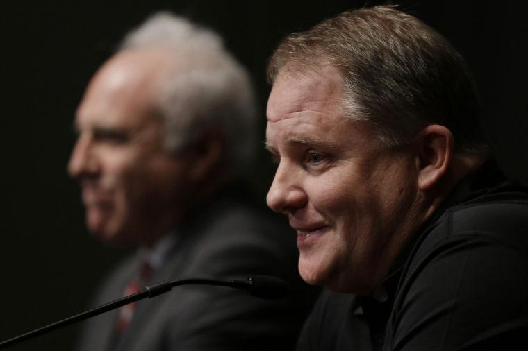 Philadelphia Eagles head coach Chip Kelly, right, accompanied by Eagles owner Jeffrey Lurie, speaks during a press conference at the team's NFL football training facility, Thursday, Jan. 17, 2013, in Philadelphia. (AP Photo/Matt Rourke)
 