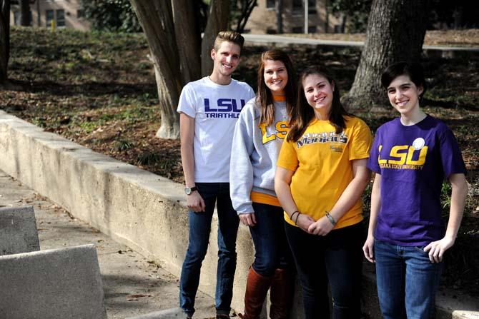 Left to right: Bryce Bourgeois, Mollye Baker, Margaret Price, and Elaine Giles pose Monday, Jan. 21, 2013, next to the Greek Theatre. These students are in charge of the event Geaux Big, a volunteering event being held April 20th.
 