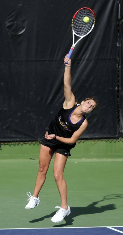 LSU sophomore Mary Jeremiah serves Saturday, Jan. 26, 2013 during the doubles match against Northwestern at "Dub" Robinson Stadium.
 