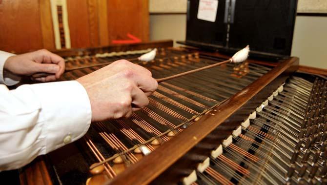 College of Music &amp; Dramatic Arts Dean Laurence Kaptain plays his cimbalom Tuesday Jan. 29, 2013 in his practice space in the Music and Dramatic Arts building.
 