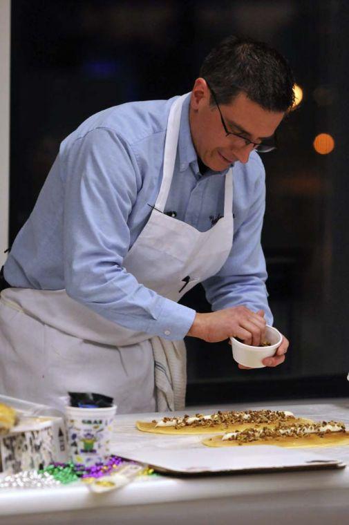 Felix Sherman Jr., the owner of Ambrosia Bakery, does a demonstration on how to make their delicious king cakes at the LSU Museum of Art on January 17, 2012.
 