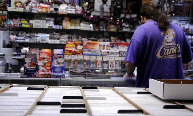 An employee labels comic books in Louisiana's Double Play, Baton Rouge's only comic book shop, Tuesday, Jan. 29, 2013. The shop is located on S. Sherwood Forest Blvd.
 