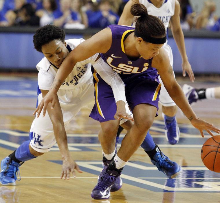 LSU's Danielle Ballard, right, gets to a loose ball in front of Kentucky's A'dia Mathies during the first half of an NCAA college basketball game at Memorial Coliseum in Lexington, Ky., Sunday, Jan. 27, 2013. (AP Photo/James Crisp)
 