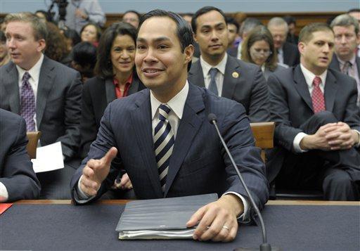 San Antonio, Texas Mayor Julian Castro, center, accompanied by his brother Rep. Joaquin Castro, D-Texas, second from right, gestures on Capitol Hill in Washington, Tuesday, Feb. 5, 2013, prior to testifying before the House Judiciary Committee hearing on America's Immigration System: Opportunities for Legal Immigration and Enforcement of Laws against Illegal Immigration. (AP Photo/Susan Walsh)
 