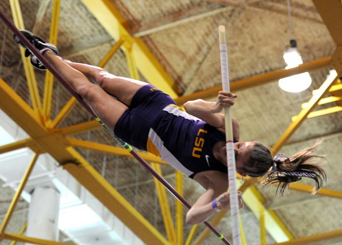 Senior LSU pole vaulter Lacey Sanchez flies over the bar Friday, Feb. 15, 2013 during the LSU Twilight Meet at the Carl Maddox Field House.
 