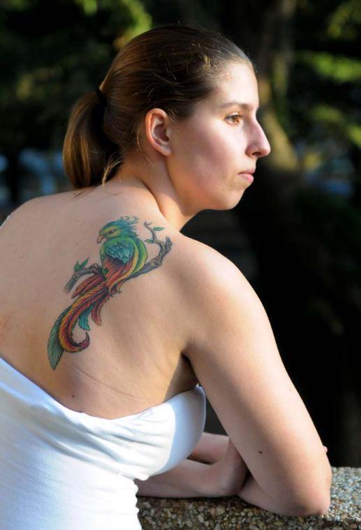 Chemistry freshman Cody Leegwater leans against the balcony overlooking Memorial Oak Grove Tuesday, Feb. 26, 2013. Her tattoo is a tribute to her grandmother.
 