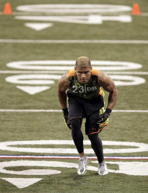 Former LSU defensive back Tyrann Mathieu runs a drill at the NFL football scouting combine in Indianapolis, Tuesday, Feb. 26, 2013. (AP Photo/Michael Conroy)
 