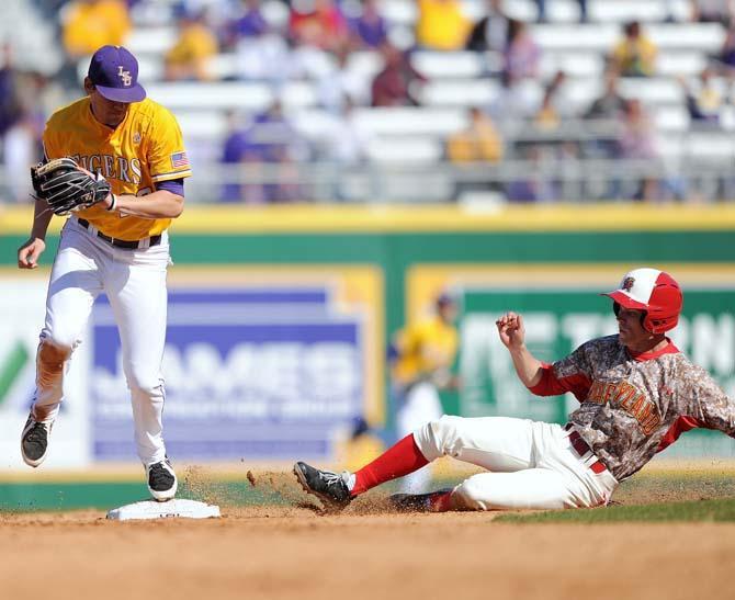 LSU junior second baseman JaCoby Jones (23) gets Maryland player out on Sunday, Feb. 17, 2013 during the third game of the season against Maryland at Alex Box Stadium.
 