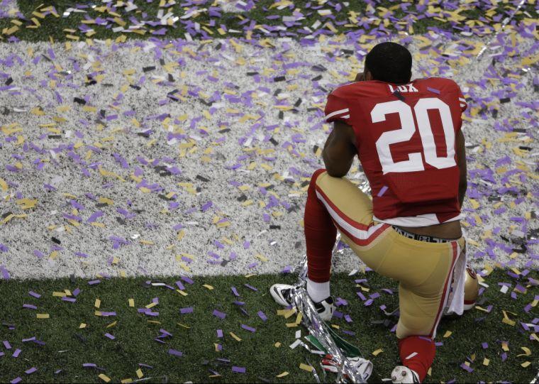 San Francisco 49ers defensive back Perrish Cox (20) remains on the field after losing 34-31 to the Baltimore Ravens in the NFL Super Bowl XLVII football game, Sunday, Feb. 3, 2013, in New Orleans. (AP Photo/Charlie Riedel)
 