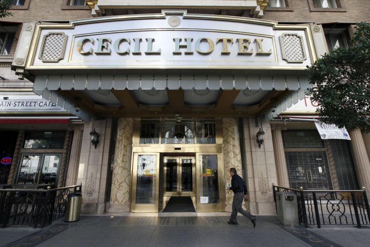 A visitor arrives at the hotel Cecil on Wednesday Feb. 20,2013 where police say the body of a woman was found wedged in one of the water tanks on the roof was that of a missing Canadian guest. Investigators used body markings to identify 21-year-old Elisa Lam, police spokeswoman Officer Diana Figueroa said late Tuesday. A maintenance worker at the Cecil Hotel found the body earlier in the day after guests complained of low water pressure. (AP Photo/Nick Ut)
 