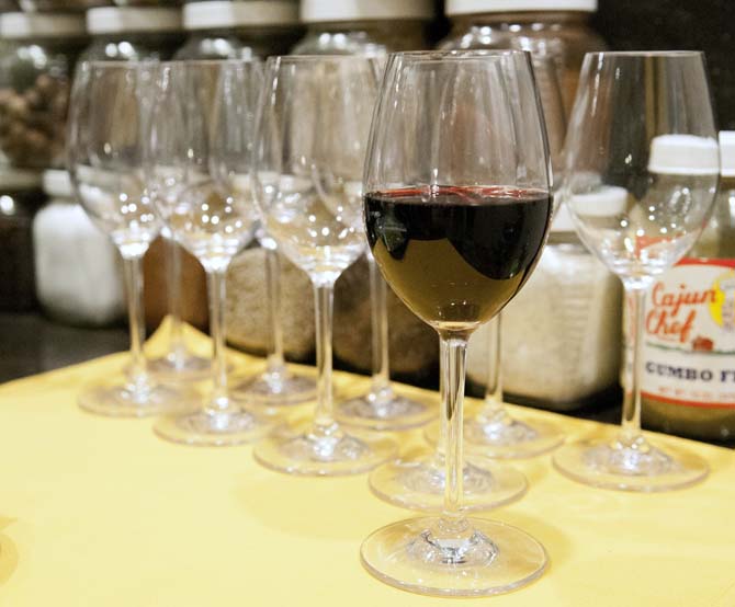 A half-full glass of wine stands alone in front of more empty glasses of wine at the gumbo Viking cooking class at the Hilton Hotel on Jan. 31, 2013.
 