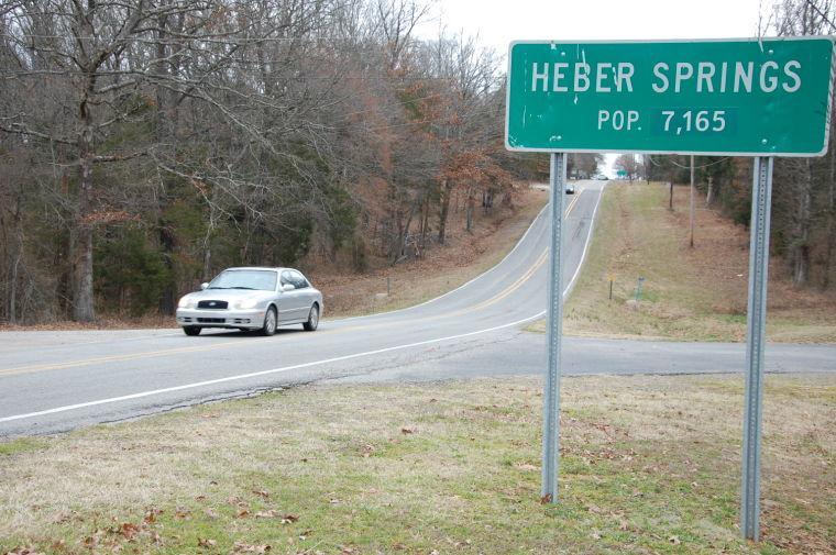 A car drives past a sign showing the population of Heber Springs, Ark., Monday, Feb. 18, 2013, where authorities say country music singer Mindy McCready died in an apparent suicide. McCready died Sunday at her home in Heber Springs, a vacation community about 65 miles north of Little Rock. She was found dead on the front porch, where her longtime boyfriend, musician David Wilson, died last month of a gunshot wound to the head. (AP Photo/Jeannie Nuss)
 