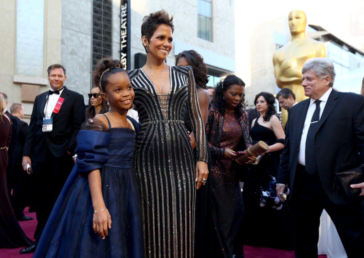 Actresses Quvenzhane Wallis, left, and Halle Berry arrive at the Oscars at the Dolby Theatre on Sunday Feb. 24, 2013, in Los Angeles. (Photo by Matt Sayles/Invision/AP)