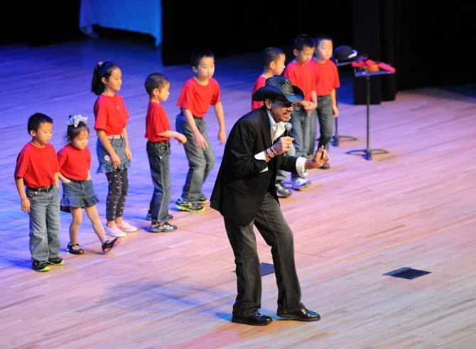 Kevin Brandt sings with children Feb. 9 , 2013 during the Chinese New Year celebration in the Union Theater.
 