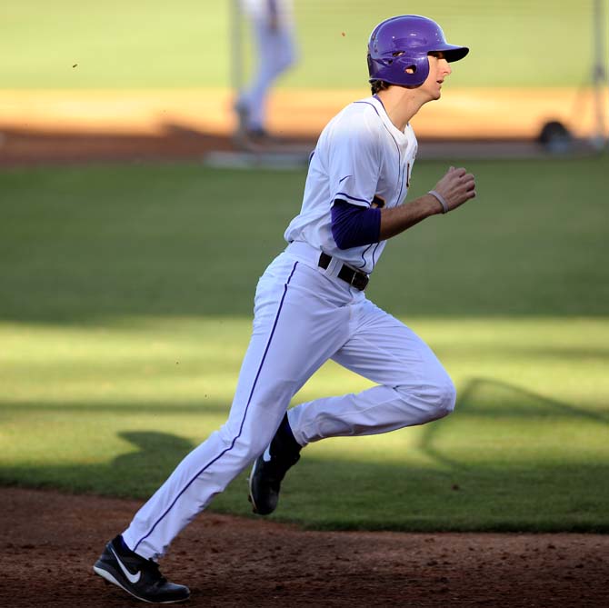 LSU freshman outfielder Mark Laird runs to home base on Friday, Feb. 1, 2013 during practice at Alex Box Stadium.
 