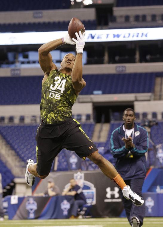 LSU defensive back Eric Reid runs a drill during the NFL football scouting combine in Indianapolis, Tuesday, Feb. 26, 2013. (AP Photo/Dave Martin)
 