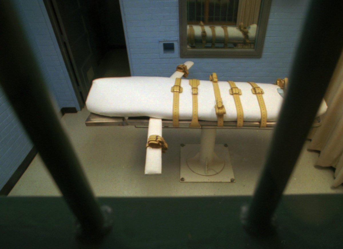 The "death bed" in the death chamber is separated by bars, foreground, from the witness viewing room at the Walls Unit of the Texas Department of Corrections in Huntsville, Texas, in this Jan. 25, 1995 file photo. Texas was the venue for the nation's most recent execution. Murderer Michael Richard died by lethal injection there on Sept. 25. Since then, executions in Texas and other states have been put on hold pending a Supreme Court decision _ expected no sooner than June _ on whether the standard lethal injection procedure can cause pain severe enough to violate the constitutional ban on cruel and unusual punishment. (AP Photo/David J. Phillip, file)