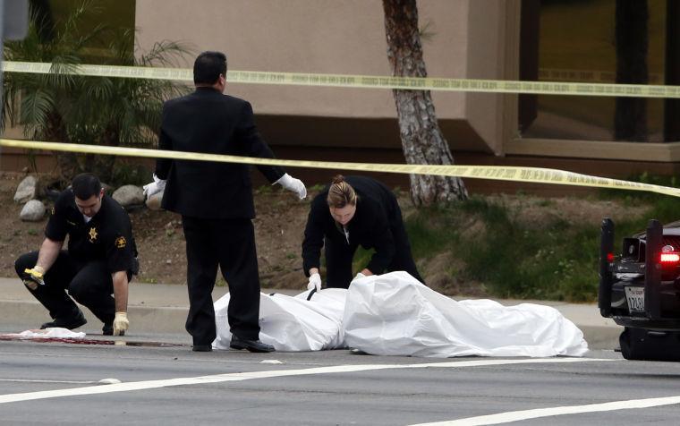 Orange County coroner's officials remove a body from the scene in Orange, Calif., Tuesday, Feb. 19, 2013. Police say a chaotic 25-minute shooting spree through Orange County left a trail of dead and injured victims before the shooter killed himself. Orange County sheriff's spokesman Jim Amormino say there are at least six crime scenes with three people, including the suspected gunman, dead and several others wounded. Tustin police Supervisor Dave Kanoti said the shootings started with an apparent carjacking just after 5 a.m. Tuesday in an unincorporated Ladera Ranch area of Orange County. (AP Photo/Jae C. Hong)
 