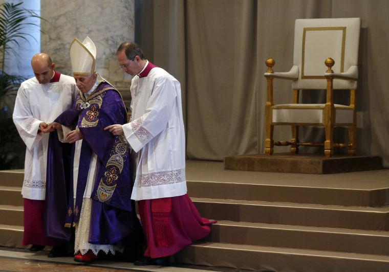 Pope Benedict XVI arrives in St. Peter's Basilica on the occasion of the celebration of Ash Wednesday mass at the Vatican, Wednesday, Feb. 13, 2013. Ash Wednesday marks the beginning of Lent, a solemn period of 40 days of prayer and self-denial leading up to Easter. Pope Benedict XVI told thousands of faithful Wednesday that he was resigning for "the good of the church", an extraordinary scene of a pope explaining himself to his flock that unfolded in his first appearance since dropping the bombshell announcement. (AP Photo/Alessandro Bianchi, Pool)
 