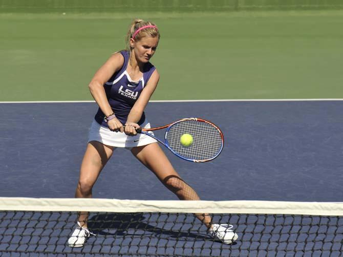 LSU junior Ariel Morton hits the ball during the Lady Tigers' tennis match against Southern Miss University on Saturday, Feb. 2, 2013 in W.T. "Dub" Robinson Stadium.
 