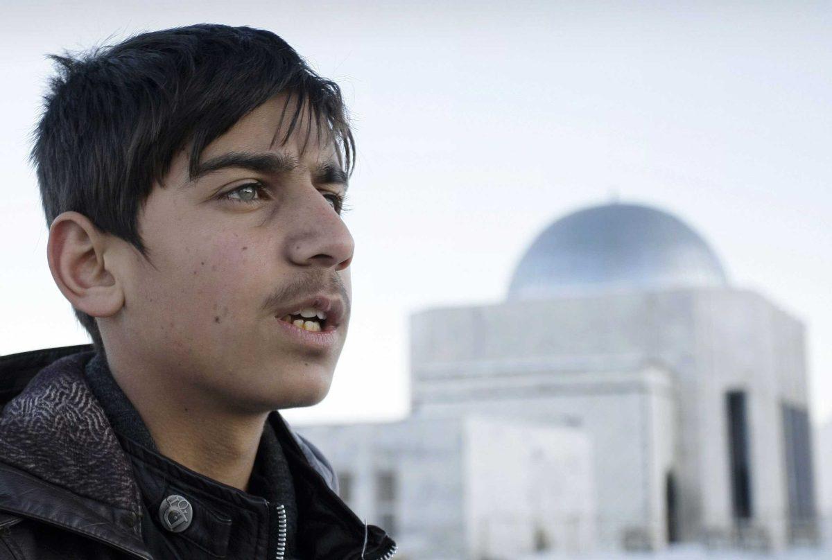 In this Wednesday, Feb. 6, 2013 photo, Afghan actor Fawad Mohammadi, 14, speaks during an interview with The Associated Presson Nader Khan's hill, one of the areas where a part of the Afghani Oscar nominated short film titled &#8220;Buzkashi Boys&#8221; was shot in Kabul, Afghanistan. Fawad Mohammadi has spent half his life peddling maps and dictionaries to foreigners in the main tourist district in Kabul. Now the 14-year-old Afghan boy with beautiful green eyes is getting ready for his first airplane ride and a trip down the red carpet at the Oscars. (AP Photo/Musadeq Sadeq)