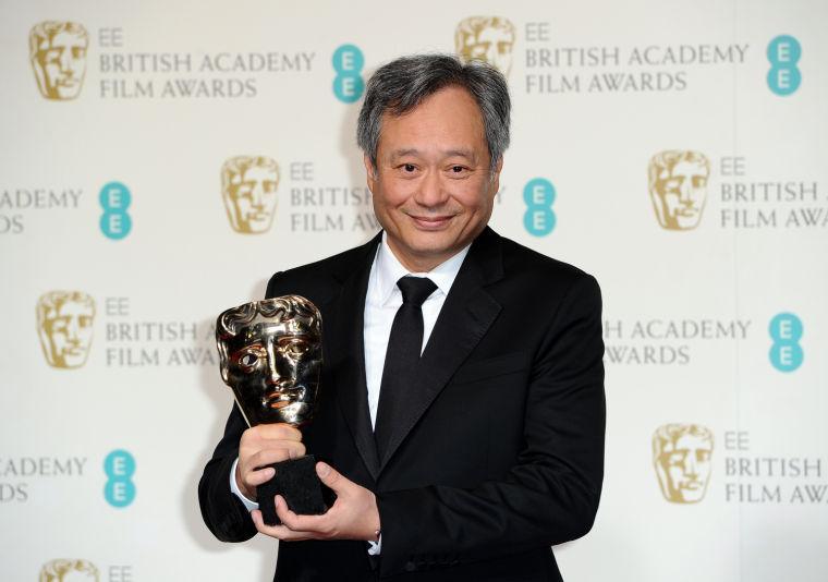 Director Ang Lee poses with the award for Cinematography in 2013 collected on behalf of Claudio Miranda backstage at the BAFTA Film Awards at the Royal Opera House on Sunday, Feb. 10, 2013, in London. (Photo by Jonathan Short/Invision/AP)
 