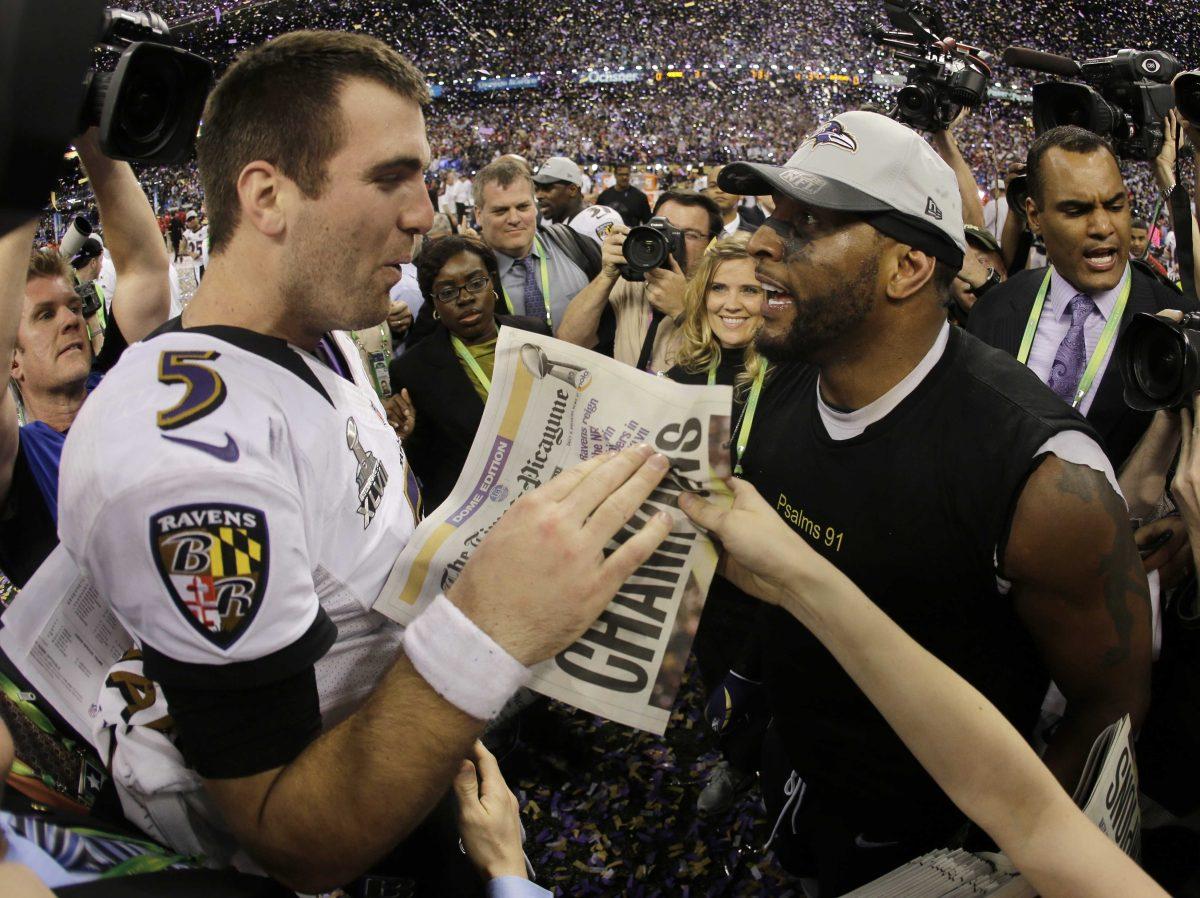 Baltimore Ravens quarterback Joe Flacco, left, and linebacker Ray Lewis celebrates their 34-31 win against the San Francisco 49ers in NFL Super Bowl XLVII football game, Sunday, Feb. 3, 2013, in New Orleans. (AP Photo/Matt Slocum)