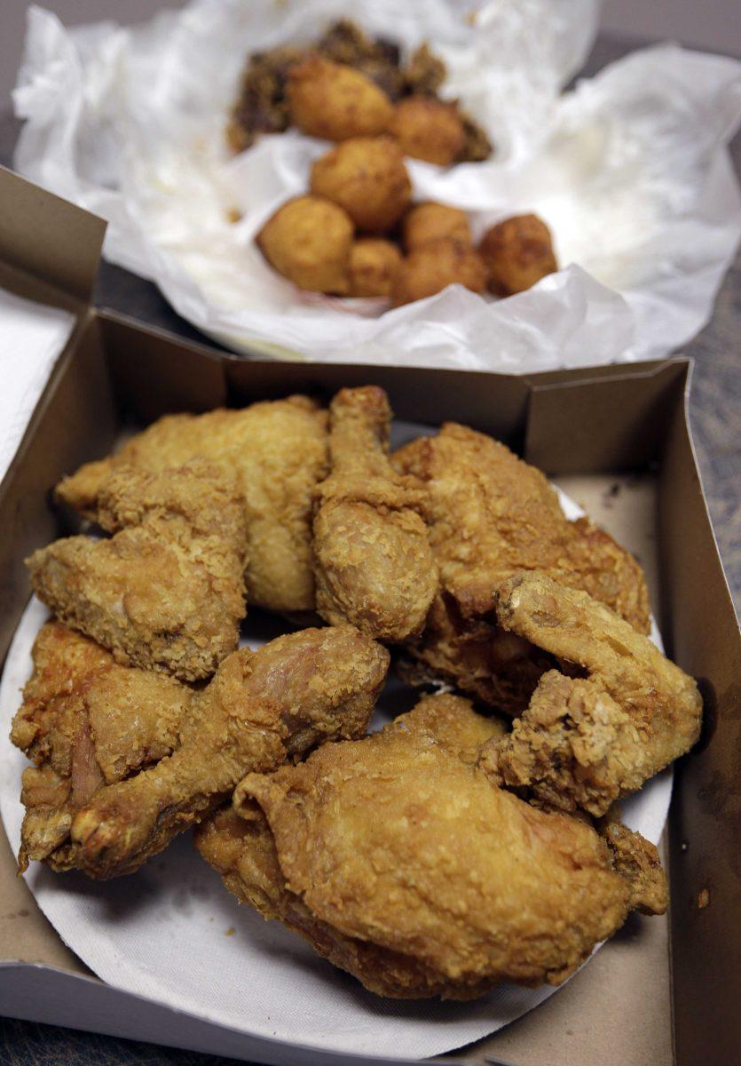 This Wednesday, Feb. 6, 2013 photo shows fried chicken, foreground, and fried chicken livers with hush puppies at a restaurant in Charlotte, N.C. Deep-fried foods may be causing trouble in the Deep South. People whose diets are heavy on them and sugary drinks were more likely to suffer a stroke, according to a new study released Thursday, Feb. 7, 2013. (AP Photo/Chuck Burton)